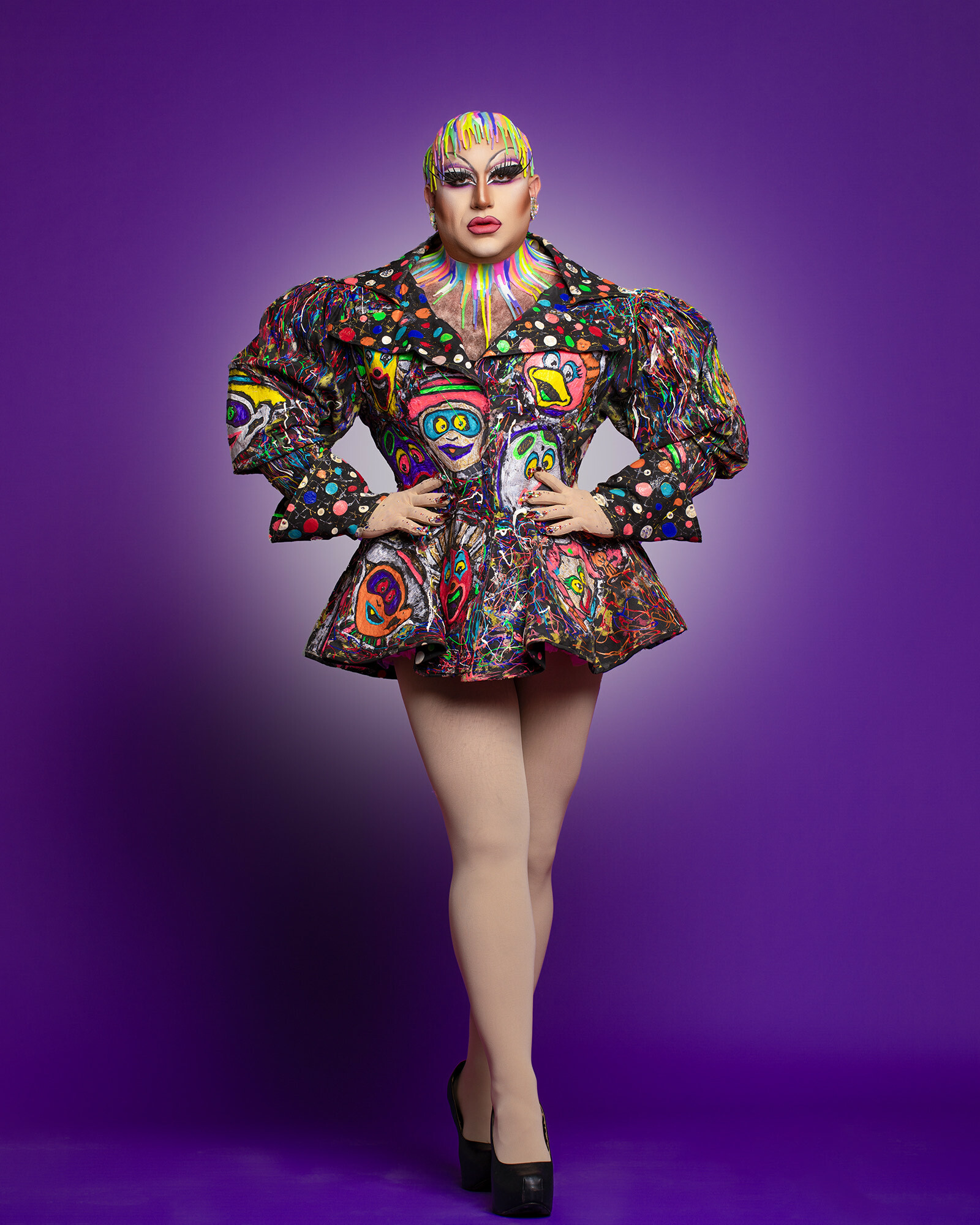 A drag performer in a colorful outfit.