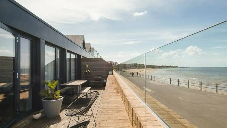 The minimalist beach house with a balcony