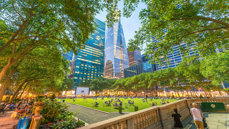 Relaxing in Bryant park after dusk. 