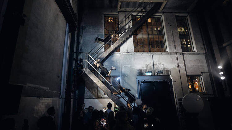 Dancers on a staircase at Machine Hall