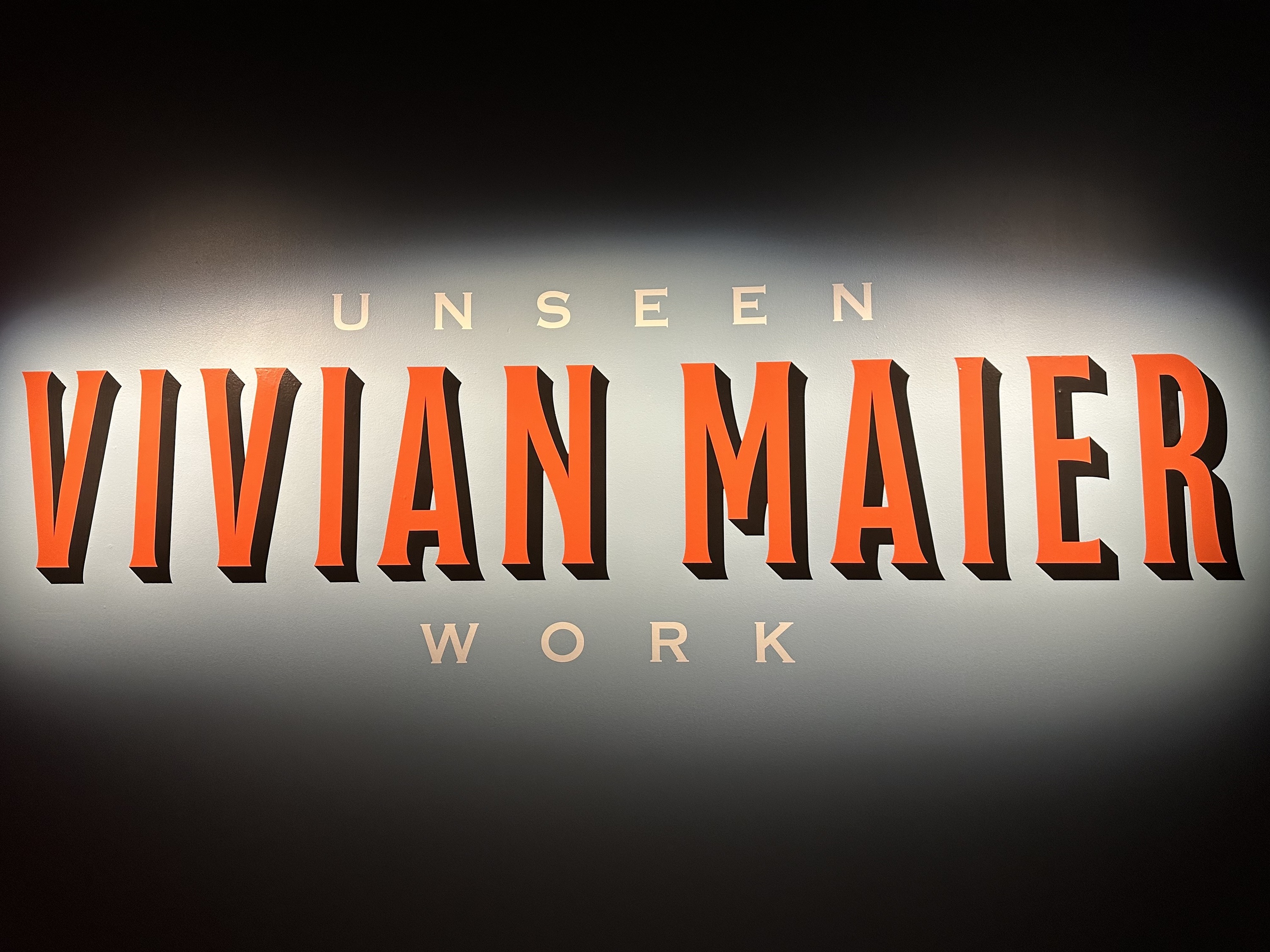 A sign reading Vivian Maier: Unseen Work.