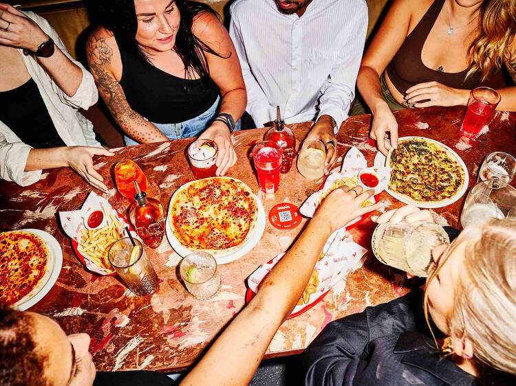 Gorge on entire pizzas for just 18c a pop at Lucky Coq's DJ star-studded birthday bash