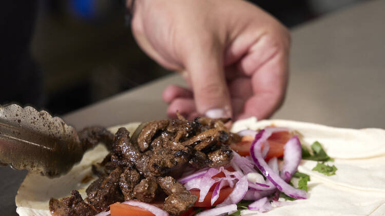 Shawarma wrap being prepared.