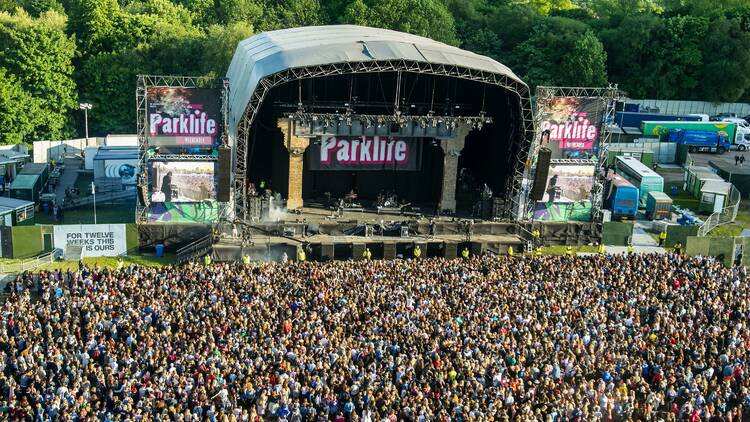 Overhead image of lots of people looking at a stage which says 'Parklife' on it