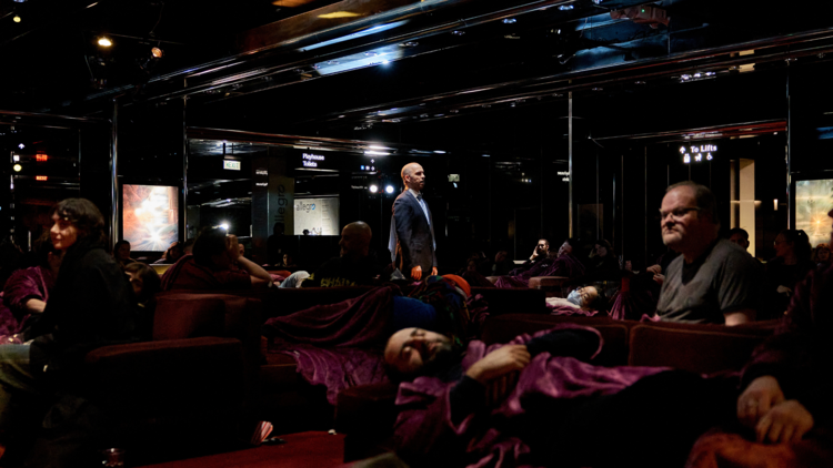 Attendees sleep in the foyer of the arts centre