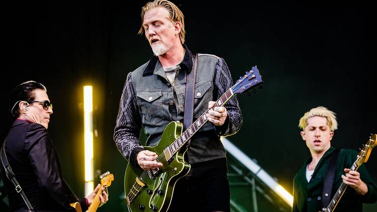 Queens of the Stone Age performing at a music festival in Europe