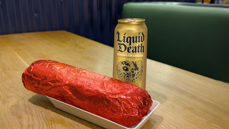 The 1kg burrito from Mad Mex with a can of Liquid Death.