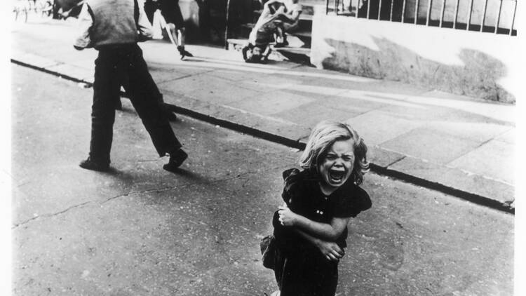 Look at Roger Mayne’s bleak but playful street photography of kids in ’50s London