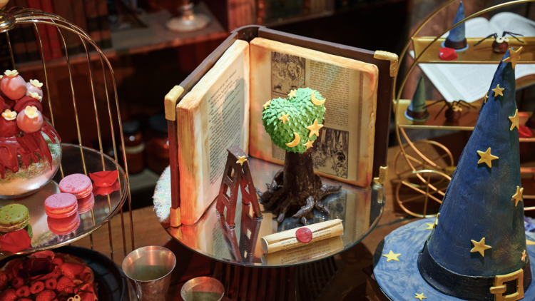 A table of creative harry potter themed desserts 