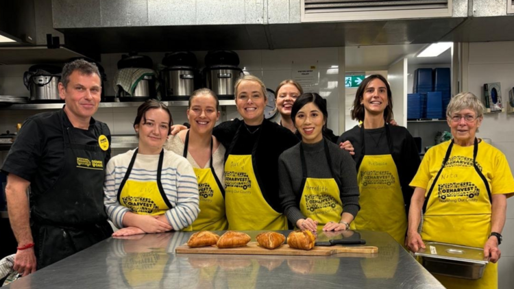 Team posing in OzHarvest kitchen