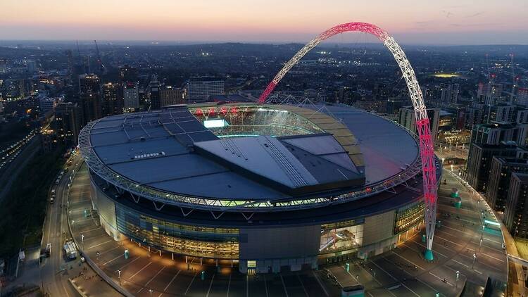 Wembley Stadium in London at night