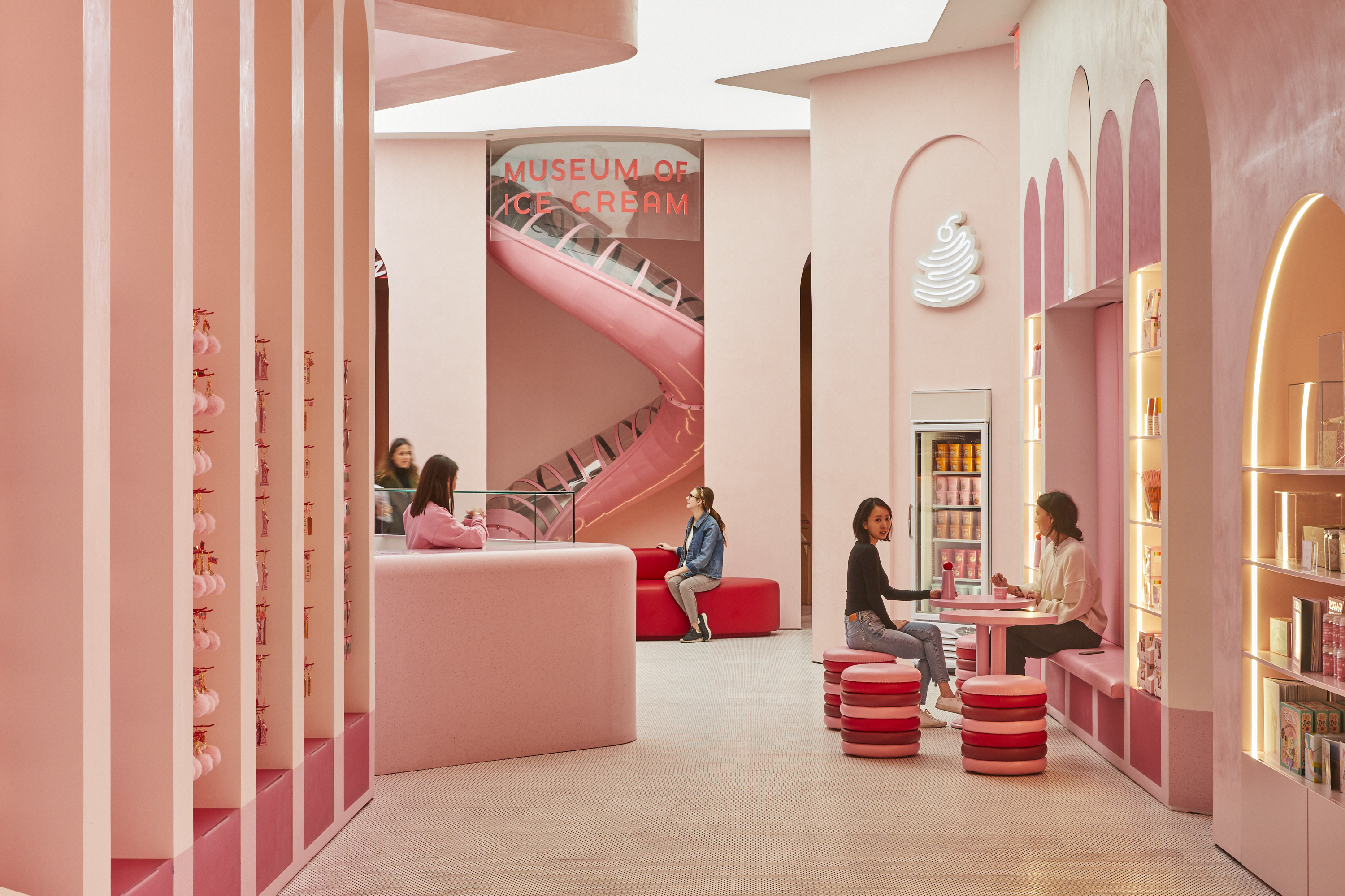 A lobby with pink designs.