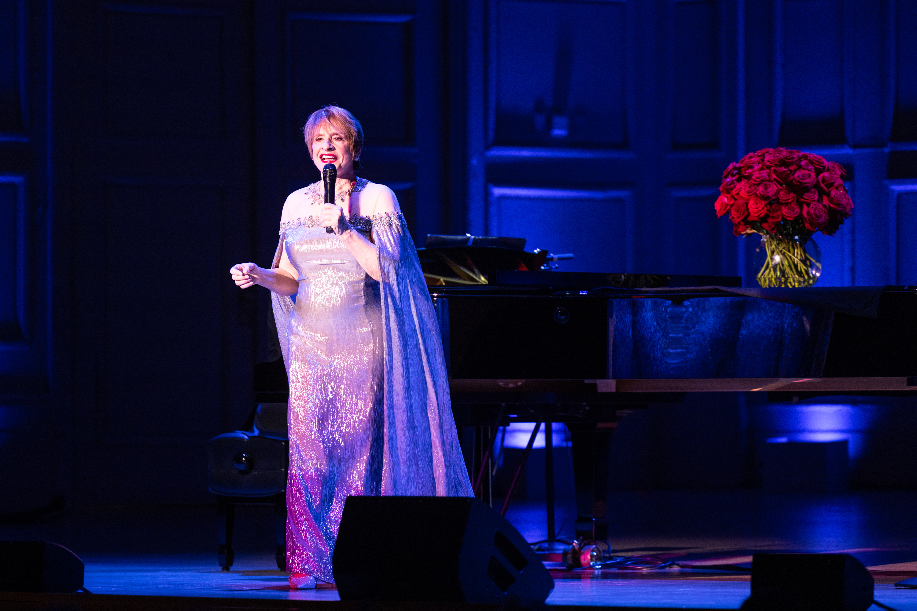 Patti LuPone performs on stage in gown