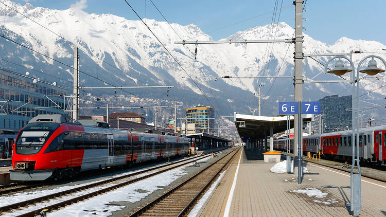 Innsbruck train station with mountains in the background