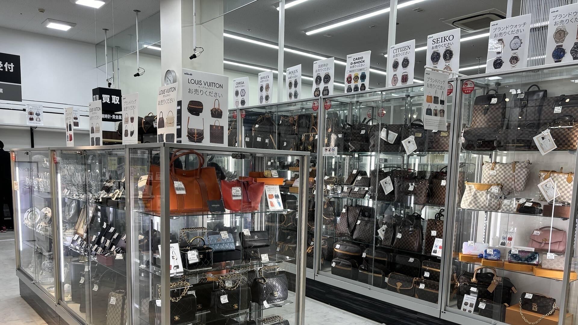 Handbags and watches displayed in a resale store