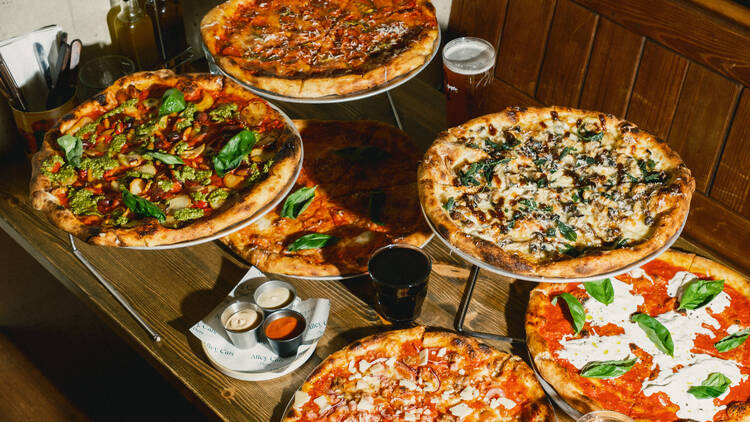 A table of New York-style pizzas 