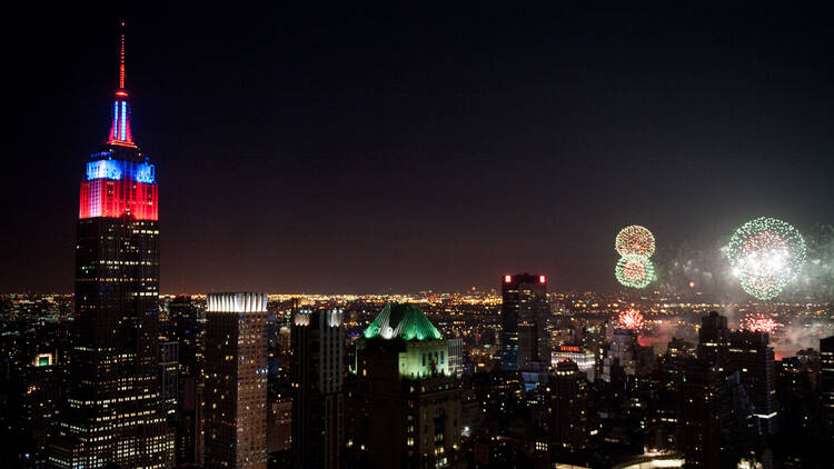 The Empire State Building tower lights change colors during the annual Macy's Fireworks display over the Hudson River celebrating Independence Day, Thursday, July 4, 2013.