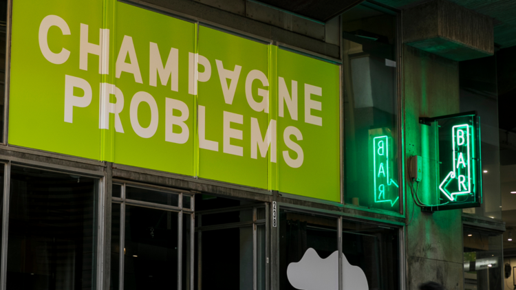 Champagne Problem's lime-green sign.