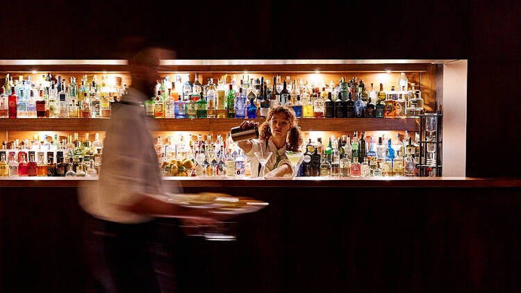 Two bartenders working at Gin Palace.