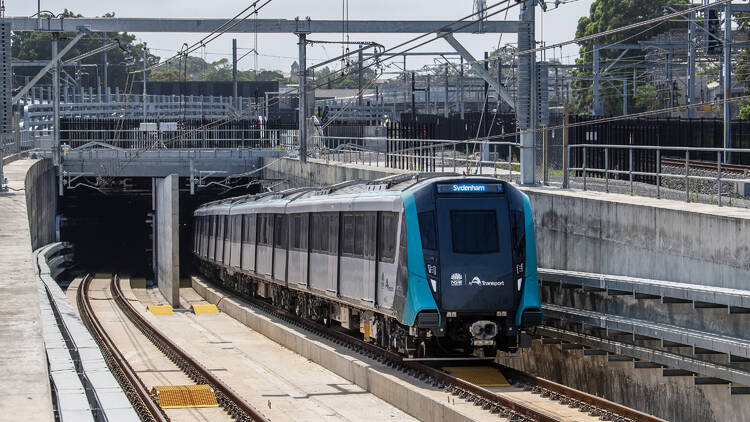 Sydney Metro City and Southwest train TS5 leaves the tunnel at the southern dive during testing.