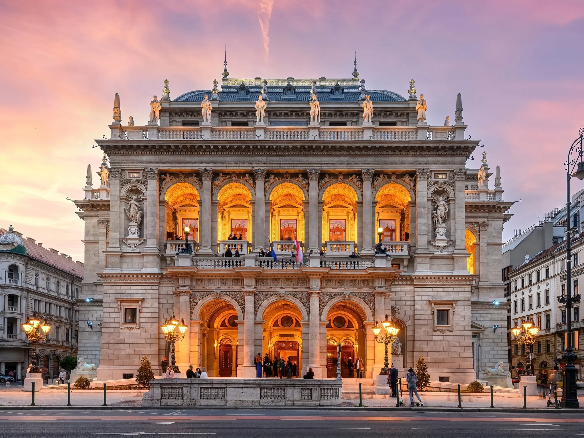 The front of the Hungarian Royal State Opera House, lit up at night