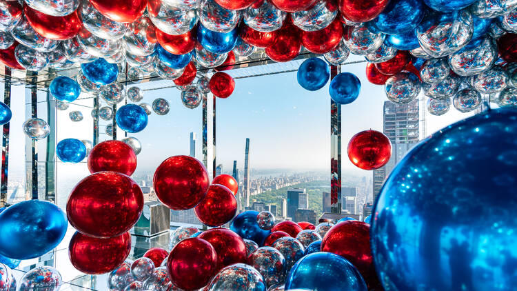 floating red white and blue balloons at SUMMIT One Vanderbilt 