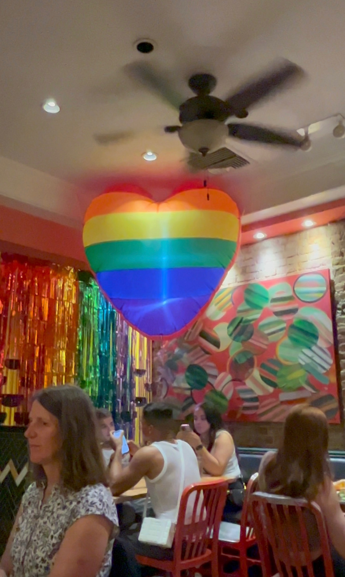 an inflatable rainbow heart