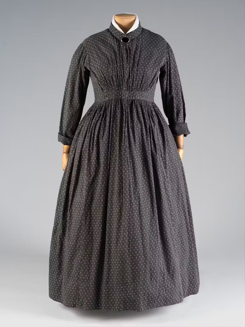 A black cotton work dress from 1865.