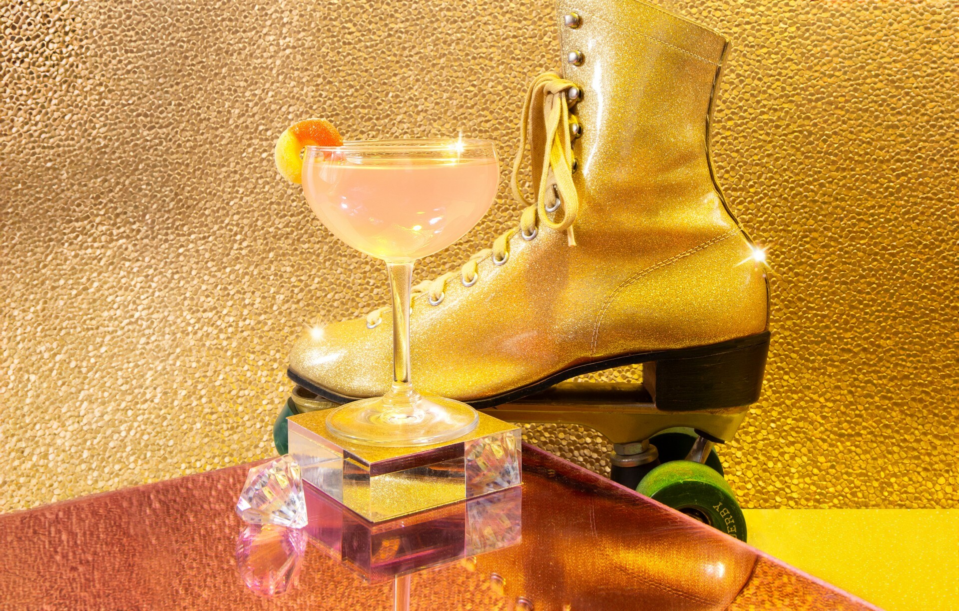 Xanadu roller rink’s stardust cocktail in front of a golden skate