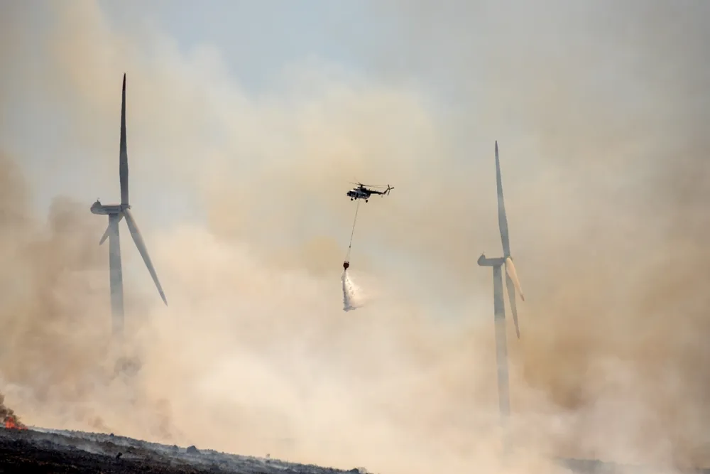 A helicopter tackles a fire in Izmir, Turkey, in July 2023