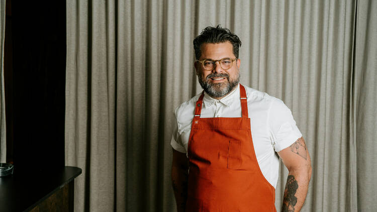 Chef Alejandro Saravia smiling for the camera.