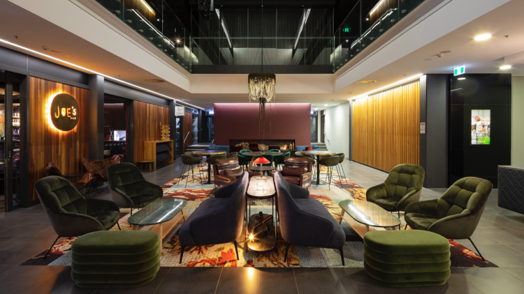 East Hotel reception/lobby with colourful rug and seating