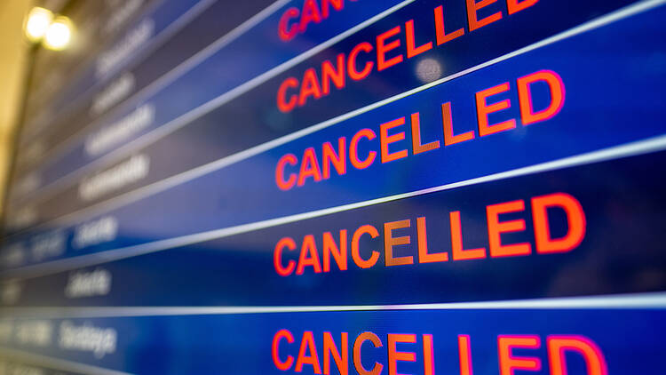A board showing cancelled flights