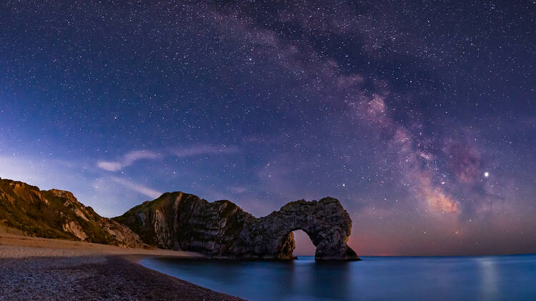 The Milky Way over Durdle Door in Dorset, England