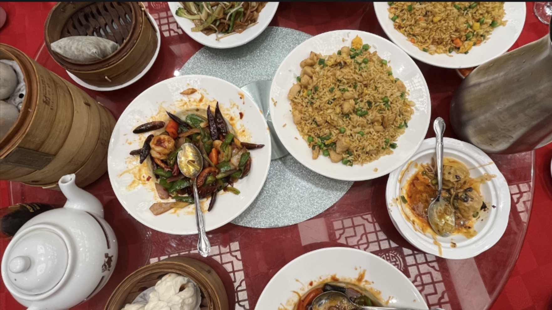 Dim sum including fried rice, noodles, and dumplings