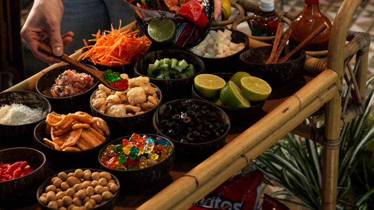 Cart loaded with Doritos and toppings