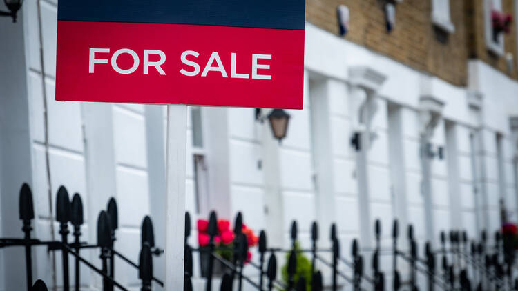 Image of a for sale sign outside of a house in London