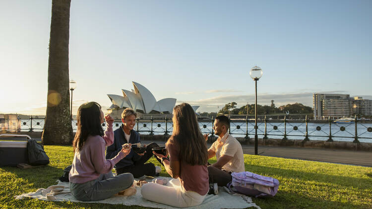 Young people enjoying a picnic at Hickson Reserve in Sydney