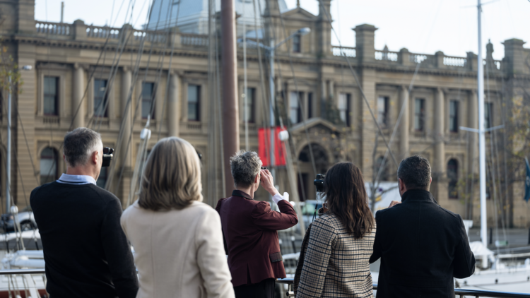 Two couples on a history tour led by guide