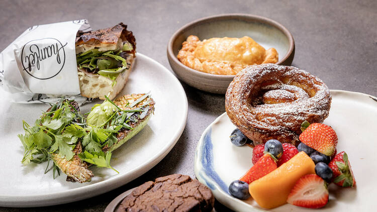 Brunch spread with sandwich and pastries