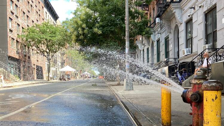 Open hydrant in NYC during the summer