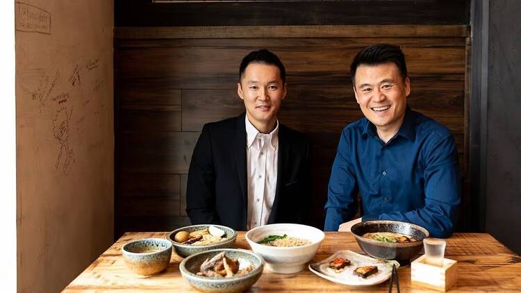 Photo of Naoki Kyobashi and Justin Lim sitting at a table