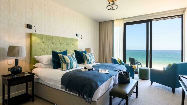 A room with a bed and a sea view