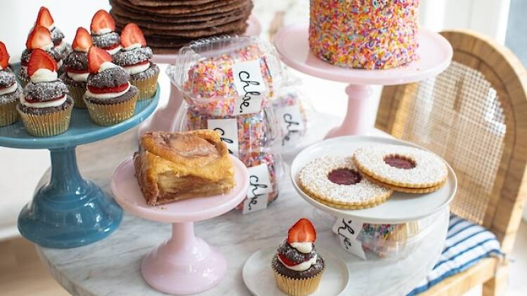 Table filled with cupcakes, cookies, and cakes from Chloe on Bleecker