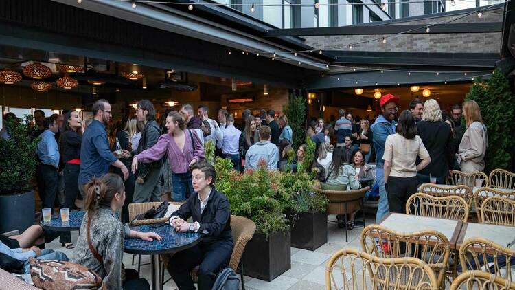 Shot of crowded Jaffa Cocktail & Raw Bar patio