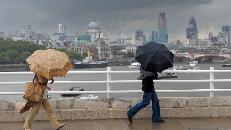 People in London in the rain with umbrellas