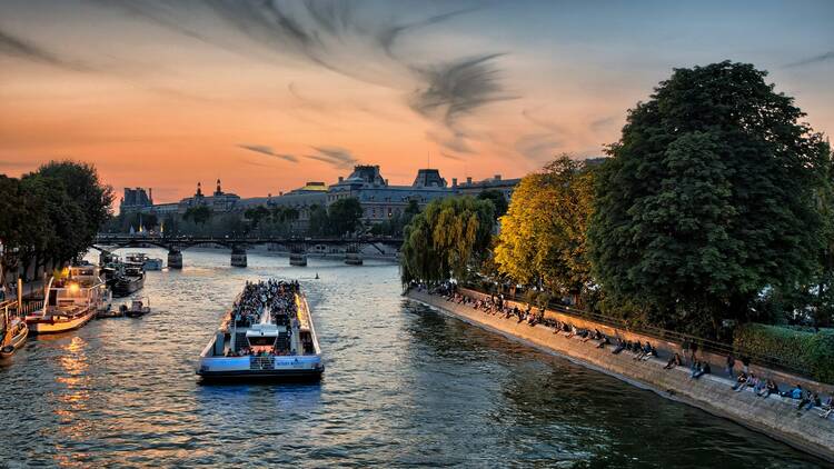 Boat riding down Seine river