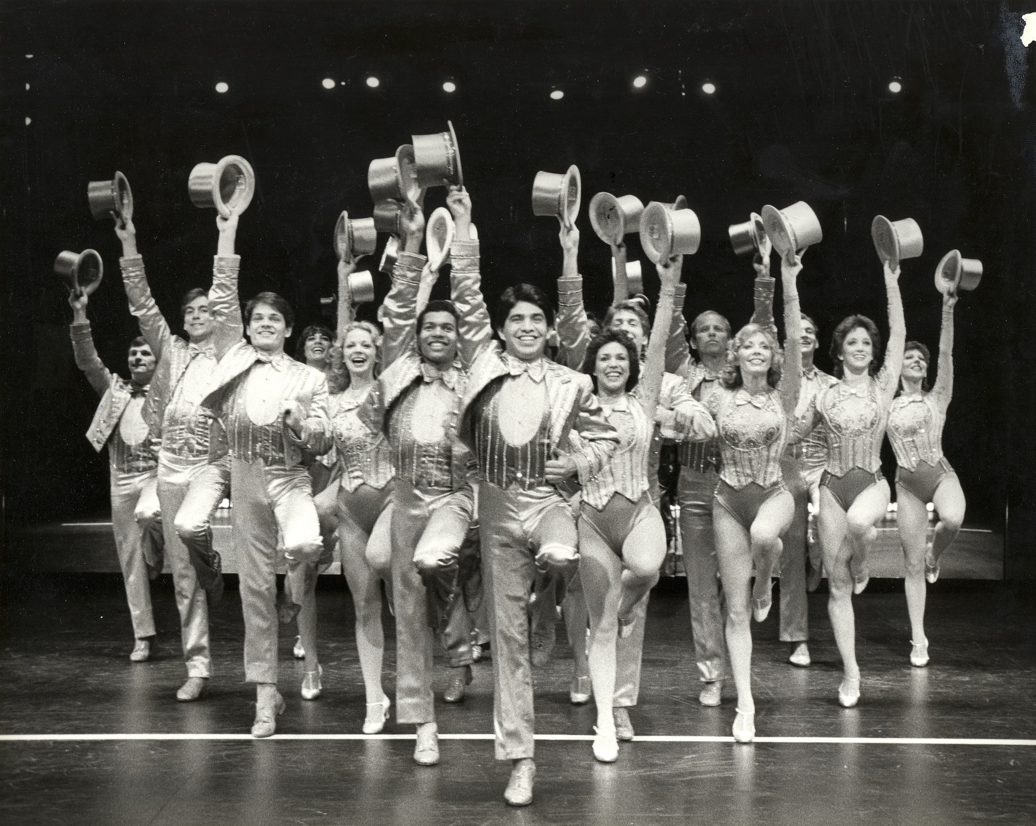 People on stage with suits and top hats during A Chorus Line.