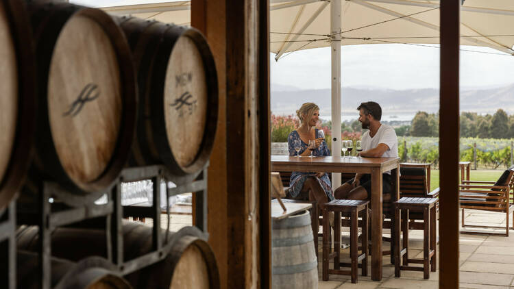 Couple enjoying wines at winery