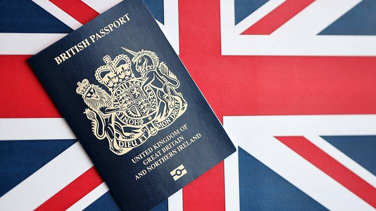 British passport on a Union Jack flag background